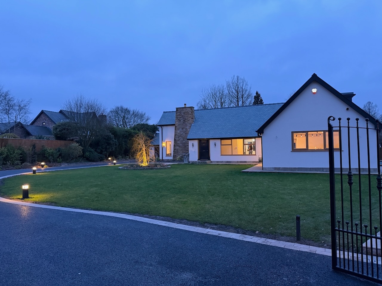 Bungalow at dusk — automated landscape lighting, front garden and driveway, Westby Lytham