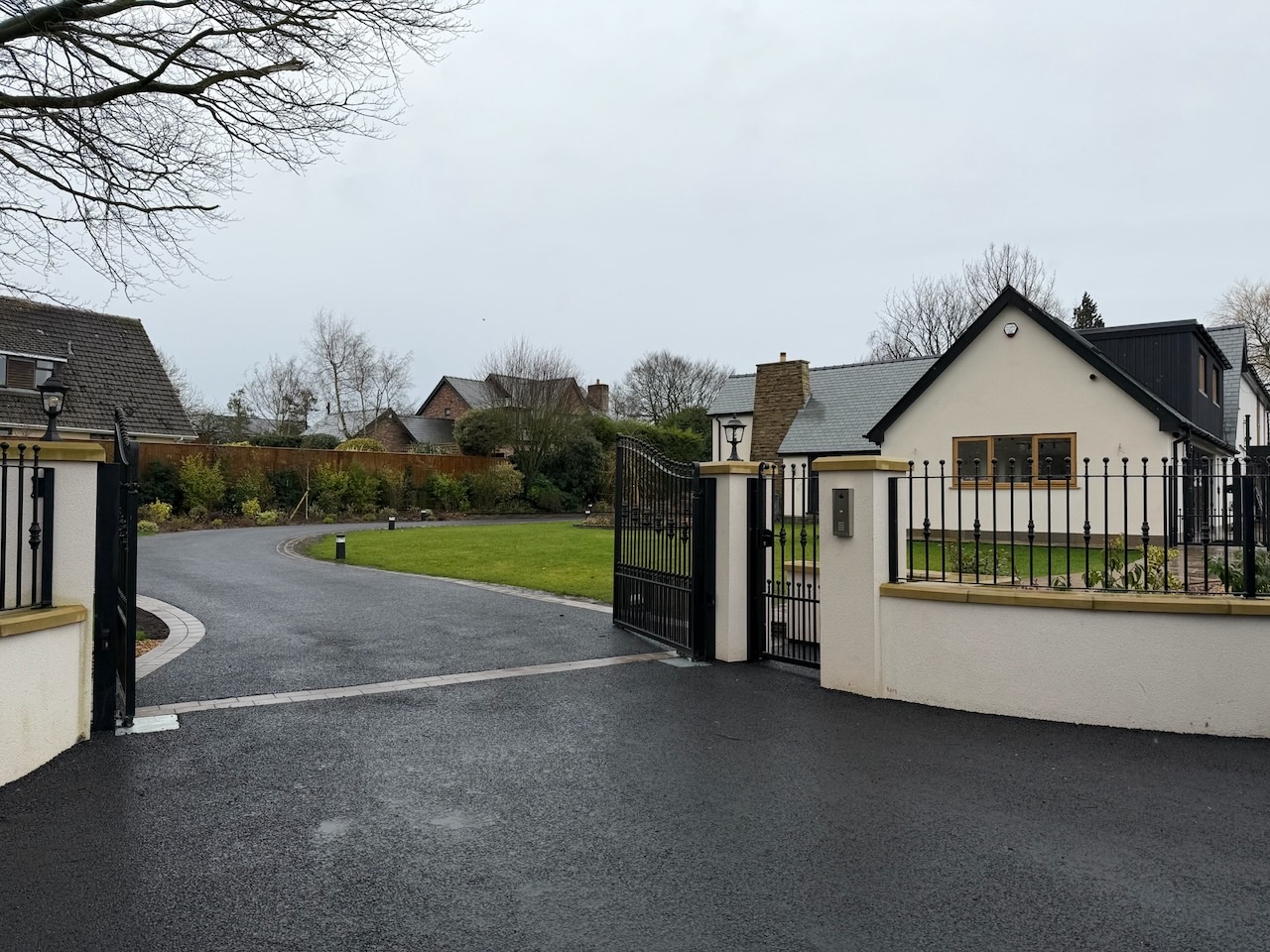 Automated gate entrance with iron gates and intercom pillar, Westby, Lytham — Wilsons Systems