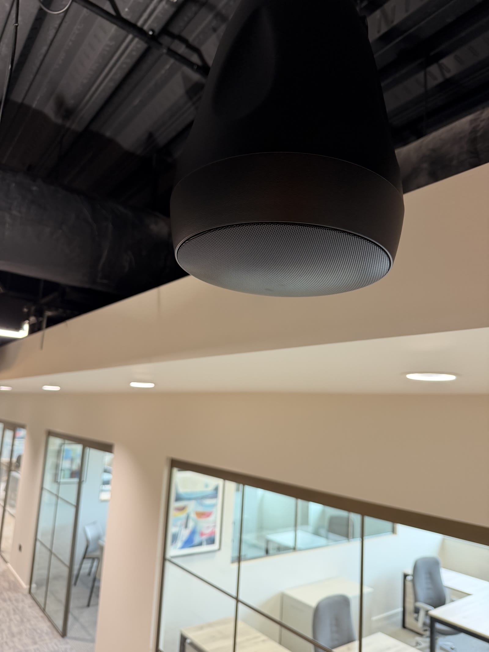 Zoned commercial audio system installed by Wilsons Systems, pendant ceiling speaker at HTI Group