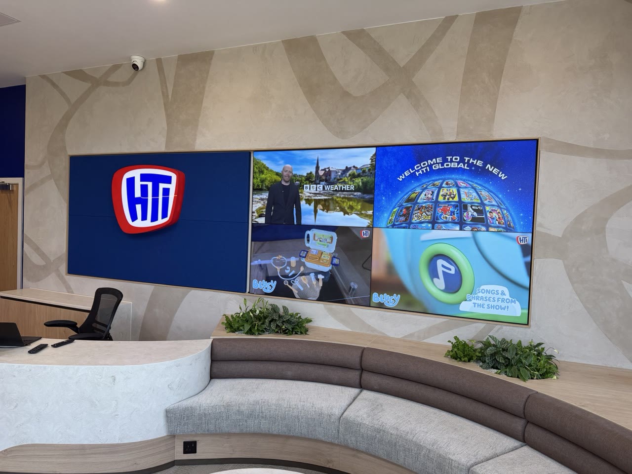HTI Group reception video wall running live content, managed digital signage platform by Wilsons Systems